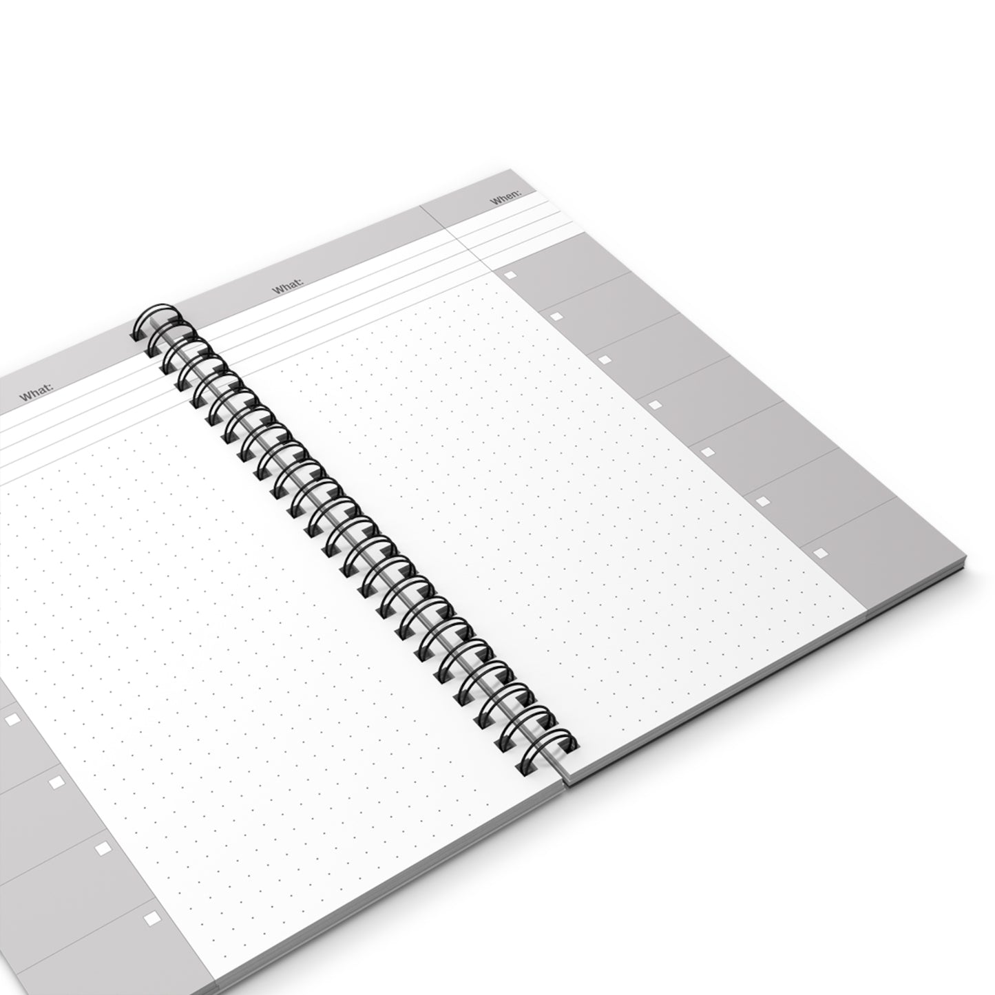 Open notebook with grid and dot grid pages on a white background