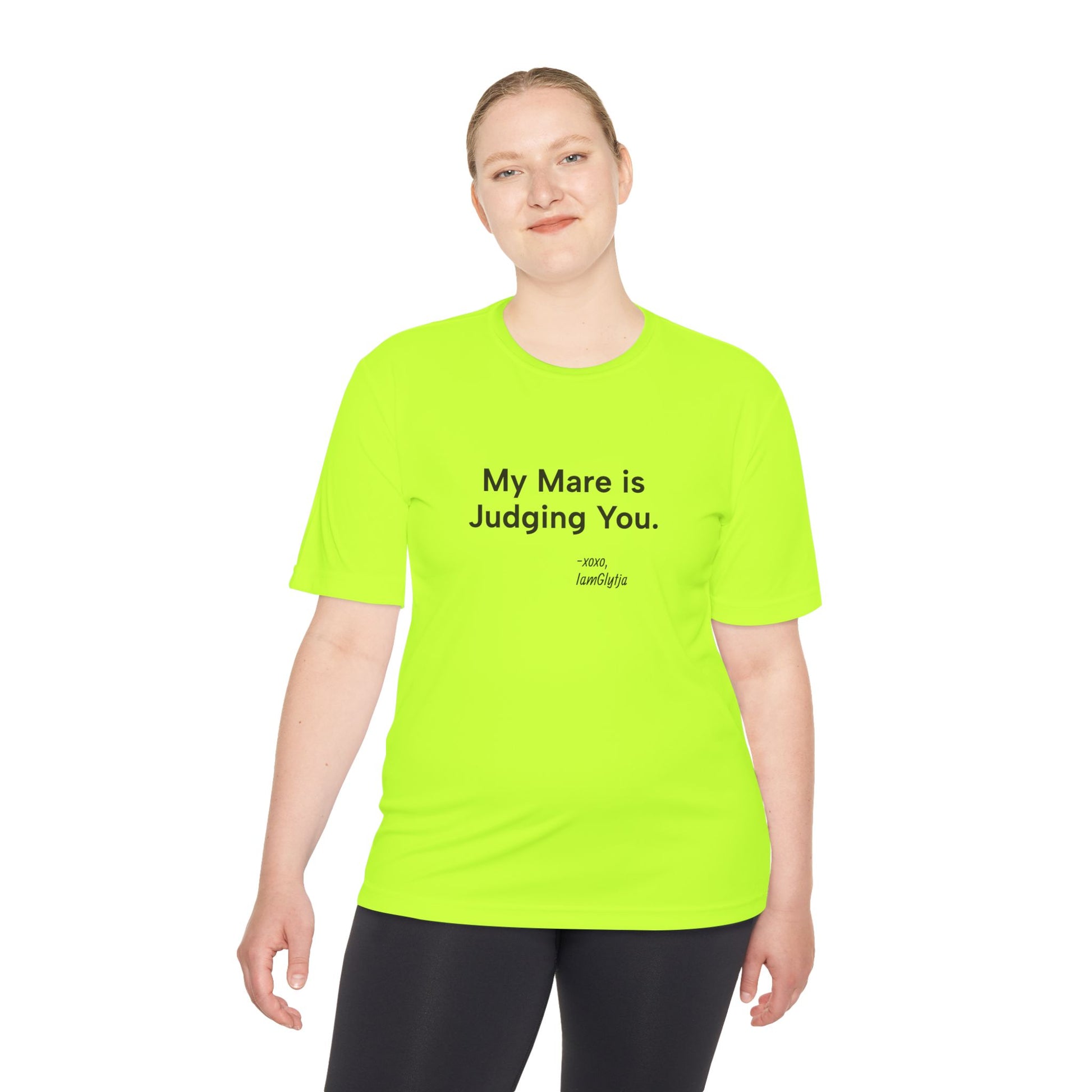 Person wearing a bright green t-shirt with text on a white background