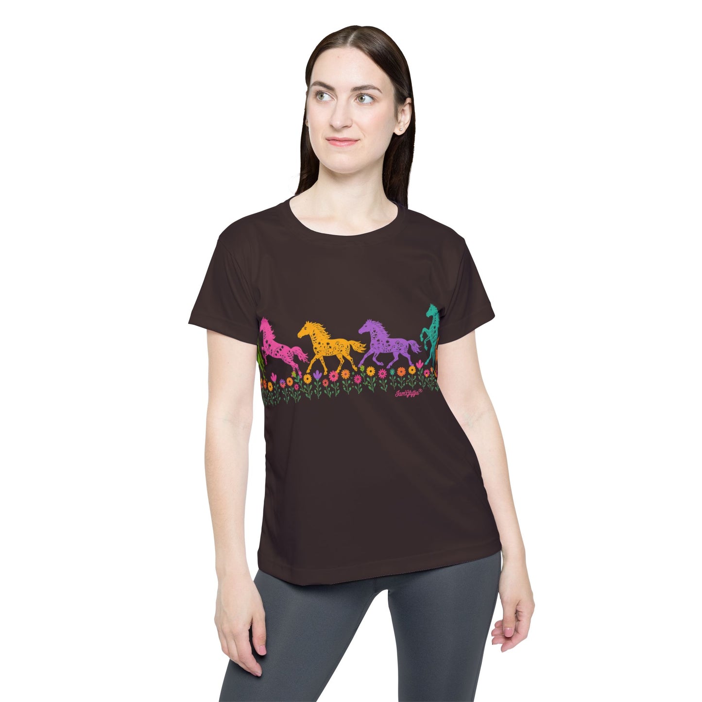 Woman wearing a black t-shirt with colorful horse design on a white background