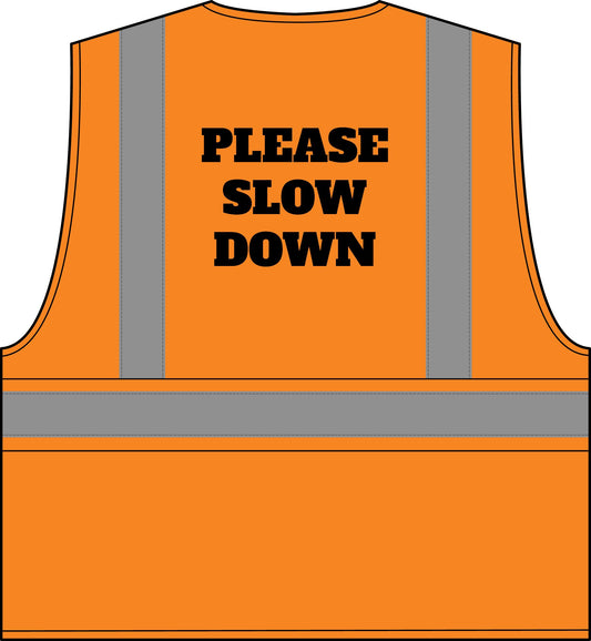 An orange high-visibility safety vest with reflective gray vertical and horizontal stripes, featuring the bold black text 'PLEASE SLOW DOWN' printed on the back, shown against a plain white background.
