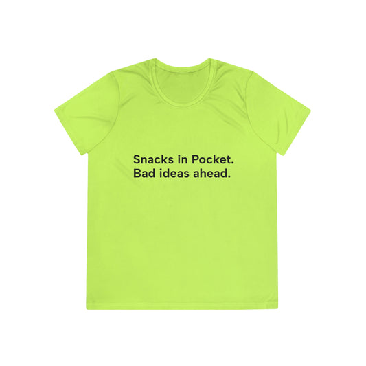 Bright green t-shirt with text 'Snacks in Pocket. Bad ideas ahead.' on a white background