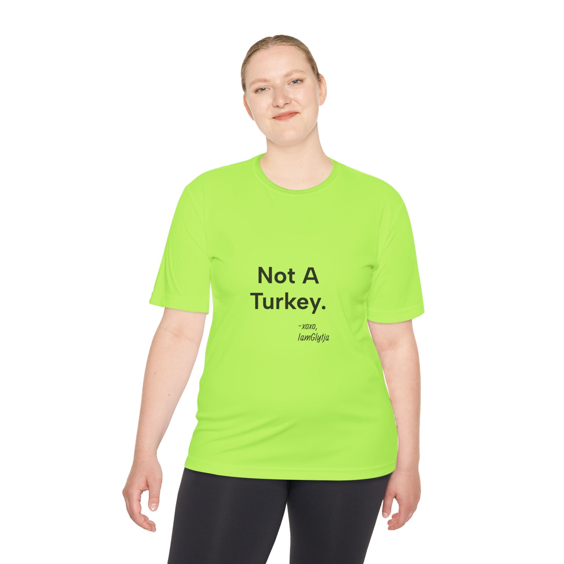 Person wearing a bright green t-shirt with 'Not A Turkey' text on a white background