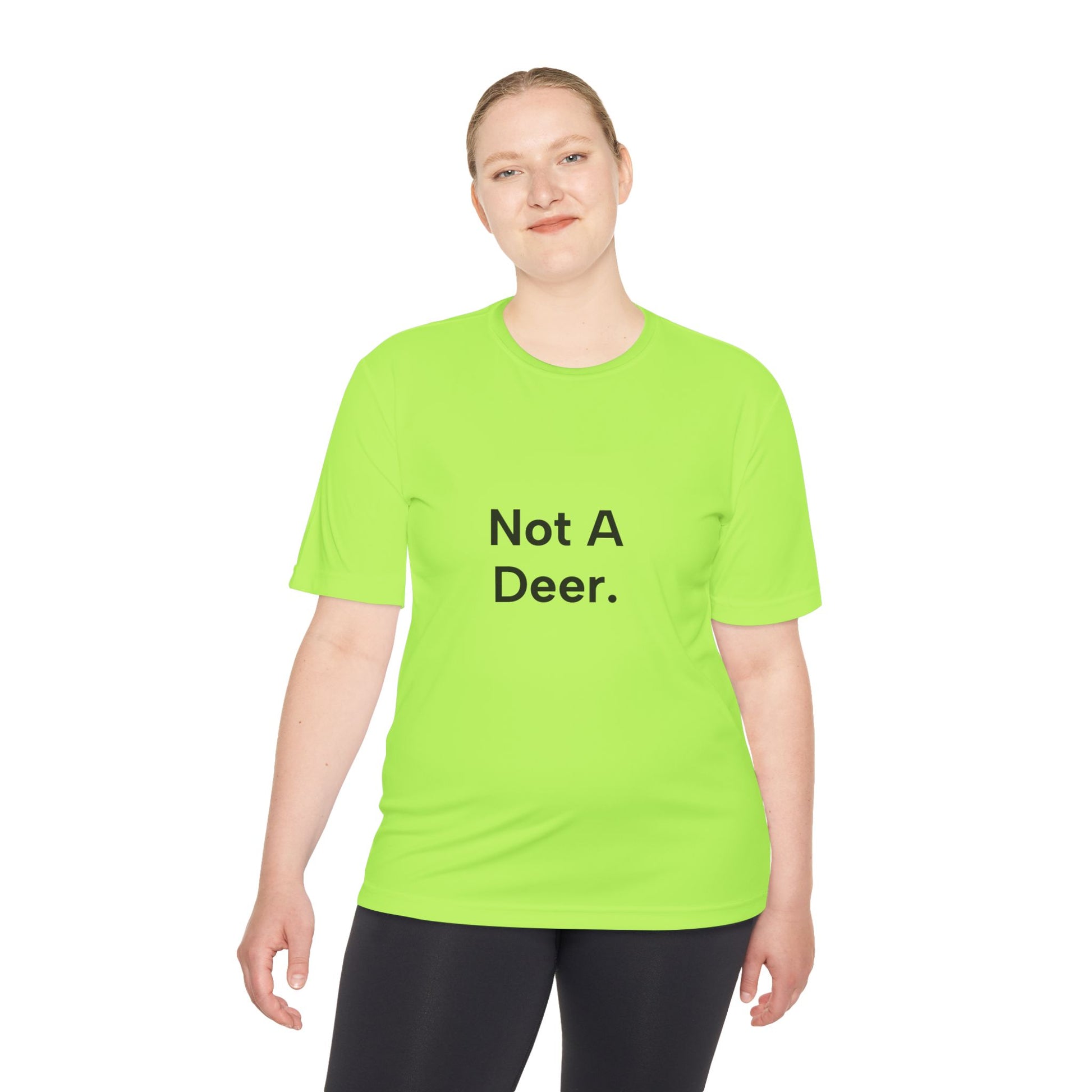 Person wearing a bright green t-shirt with 'Not A Deer' text on a white background