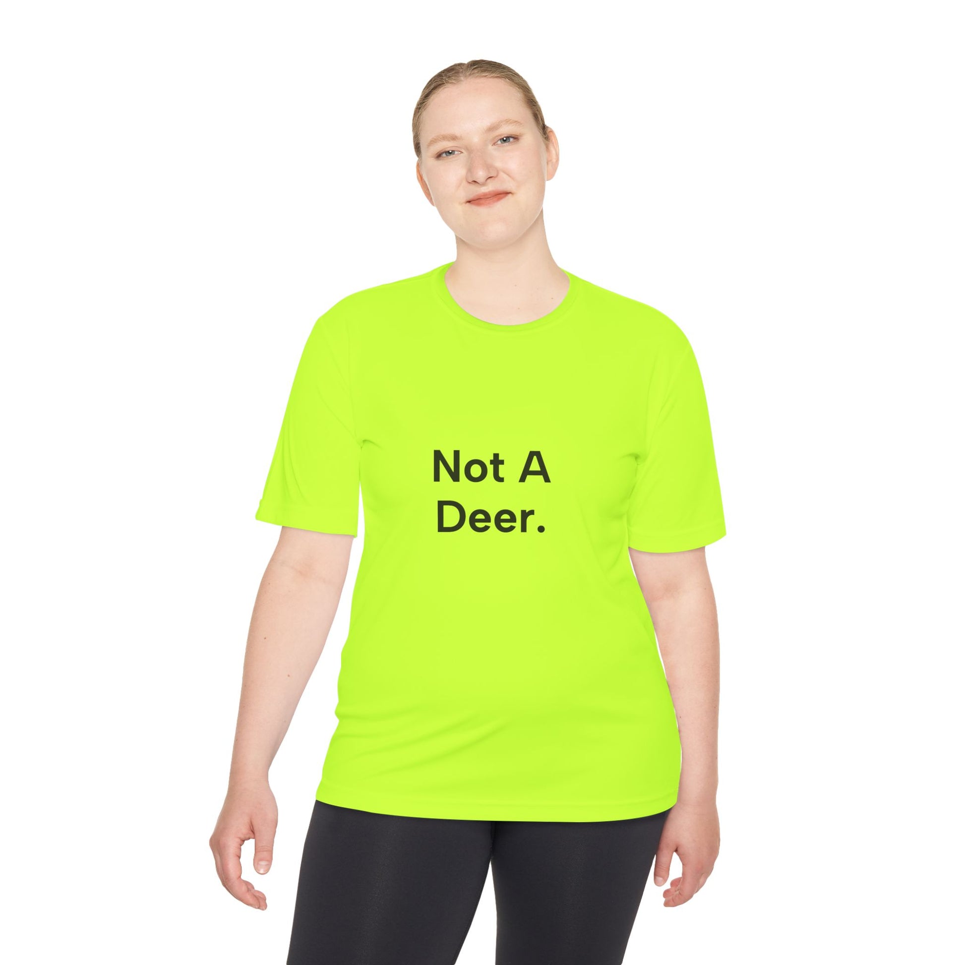 Person wearing a bright green t-shirt with 'Not A Deer.' text on a white background
